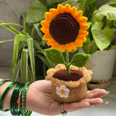 Handmade crochet sunflower plant in brown pot